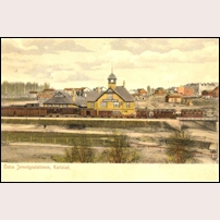 Karlstad Östra station okänt år. Det är ett kolorerat kort och färgläggaren har missat att väggbeklädnaden bestod av skiffer och i stället valt en "lämplig" färg som råkat bli denna gula. Foto: Okänd. 